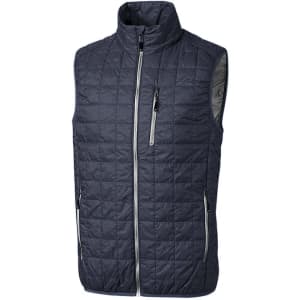A dark blue quilted vest with a high collar and multiple zippered pockets. It features a logo on one side.