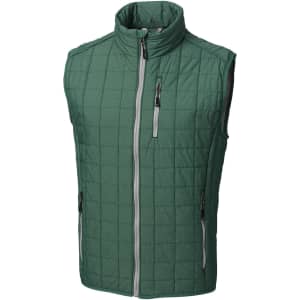 A green quilted vest with a high collar, zippered pockets, and a logo on it.