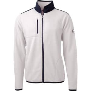 A white eco sherpa jacket with a navy collar and zipper pocket, featuring a logo on the sleeve.