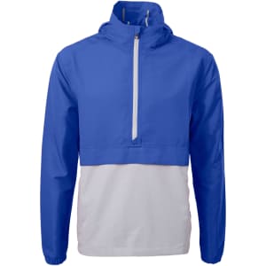 A blue and white men's anorak jacket featuring a quarter-zip and a logo on the chest.