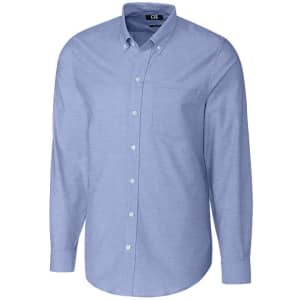 A light blue button-up shirt with long sleeves and a chest pocket, featuring a brand logo.