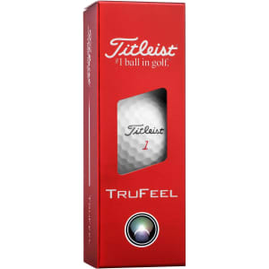 A red box containing three Titleist TruFeel golf balls, featuring a visible branded golf ball inside.