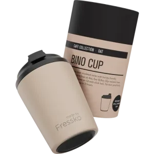 A reusable cup in beige with a black lid, featuring a branded design, packaged in a matching box.
