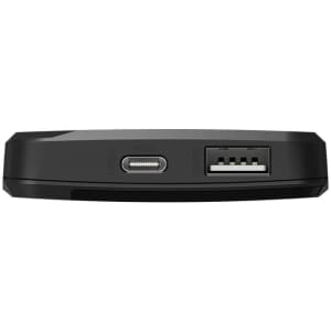 A black power bank with USB and USB-C ports, featuring a sleek and compact design.