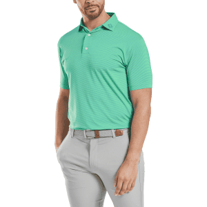 A men's polo shirt in bright green, featuring a collar and short sleeves, paired with grey trousers, includes a logo.
