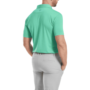 A men's short-sleeve polo shirt in turquoise with a collar, featuring a logo on the back and grey trousers.