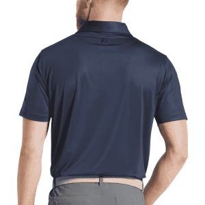 A navy men's polo shirt with a tonal dot print and a branded logo on the back collar.