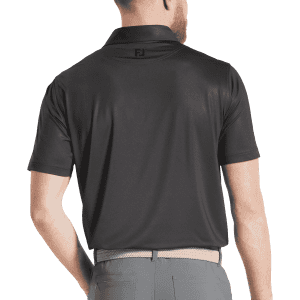 A men's black polo shirt with a tonal dot print and a logo on the back.