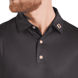 A men's black polo shirt featuring a tonal dot print, with a logo on the collar and three buttons.