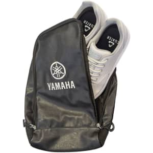 A black PU leather shoe bag featuring a zippered closure and a logo, with white shoes partially visible inside.