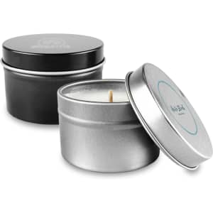 A tin candle set featuring a silver and black container with a visible wick. Both tins have different designs.