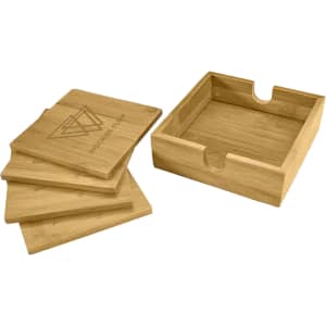 A set of bamboo coasters in natural tones, neatly stacked beside a wooden tray, featuring a simple logo.