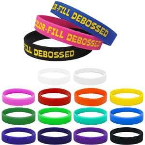 A variety of silicone wristbands in multiple colours, featuring debossed text and branding designs.