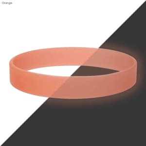 An orange silicone wristband on a contrasting black and white background, featuring a logo.