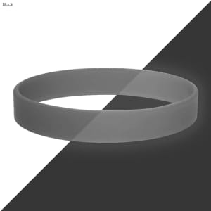 A black silicone wristband with a smooth finish, featured on a contrasting background.
