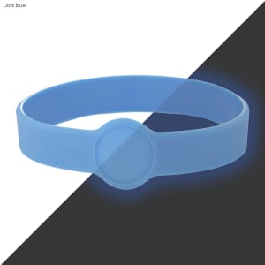 A dark blue silicone wristband with a circular design element, suitable for customisation.