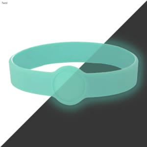 A teal silicone wristband with a circular badge, featuring a neon glow effect against a dark background.