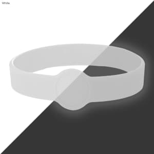 A white silicone wristband with a circular feature, featuring a logo.