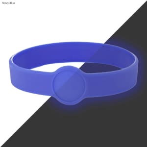 A navy blue silicone wristband with a circular design element and a prominent logo area.