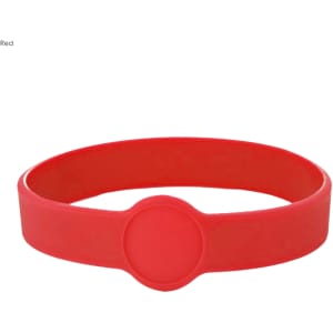 A red silicone wristband featuring a circular section and a logo. Suitable for custom designs.