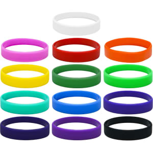 A collection of silicone wristbands in various colours, including white, purple, orange, red, yellow, green, aqua, blue, and black.