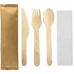 A wooden cutlery set featuring a knife, fork, spoon, and napkin, all in natural wood colour with a packaging sleeve.