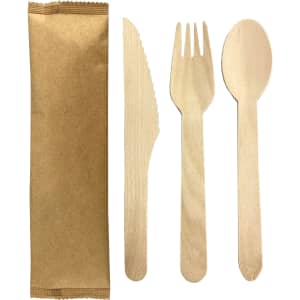 A wooden cutlery set featuring a knife, fork, and spoon, packaged in brown paper.