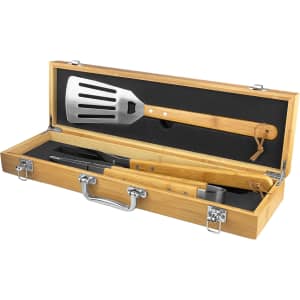 A bamboo BBQ set featuring a stainless steel spatula, tongs, and a bottle opener, presented in a wooden case.