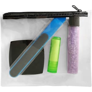 A clear cosmetic bag containing a blue nail file, green lip balm, purple treatment tube, and black compact.