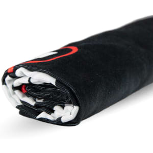 A rolled black beach towel featuring a logo, measuring 75cm x 150cm. The towel has a contrasting inner side.