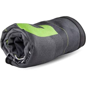 A rolled-up beach towel in grey with green accents, featuring a subtle patterned design and a logo.