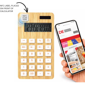 A bamboo calculator in light brown with a digital display and white buttons, beside a smartphone.
