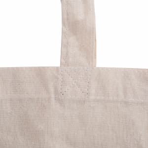 A cream-coloured tote bag with sturdy handles, featuring a simple design and a visible logo.