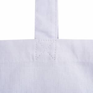 A foldable calico bag in white featuring stitching details and a simple strap design. It includes a logo.