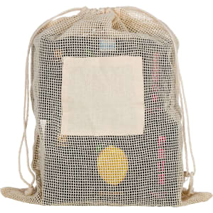 A reusable cotton mesh produce bag in cream, featuring a drawstring closure and a blank patch.