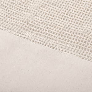 A textured beige mesh fabric, featuring a woven pattern at the top and a solid section at the bottom.