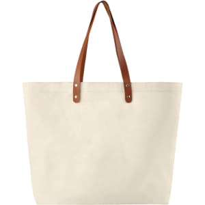 A beige cotton tote bag with brown leather handles and metal studs, featuring a simple design.