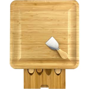 A bamboo cheeseboard with a wooden-handled knife and compartments for additional utensils.