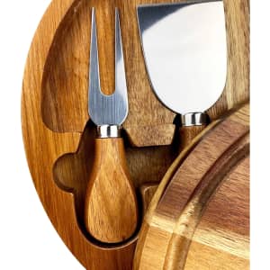 A wooden cheeseboard features a knife and fork set with stainless steel blades and wooden handles.