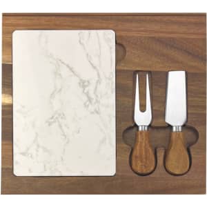 A marble cheeseboard with a wooden base and two knives featuring wooden handles.