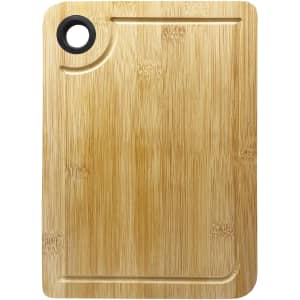 A bamboo cheeseboard with a smooth surface and a round cutout, featuring a natural wood finish.