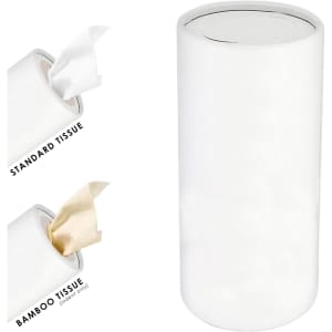 A white cylindrical container holds dry tissues, featuring standard and bamboo options. The container has a sleek design and a logo.