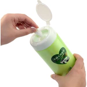 A green container with a white lid, holding wet tissues being pulled out by a hand. It features a logo.