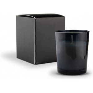 A dark blue glass candle in a box, with a minimalist design and a smooth finish. The box is black.