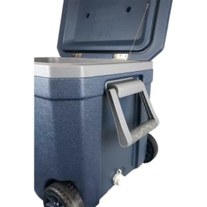 A navy blue rolling cooler box with a grey lid, featuring wheels, a handle, and an attached lid strap.