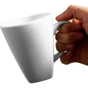 A white coffee mug with a tapered design, held by a hand, featuring a logo.