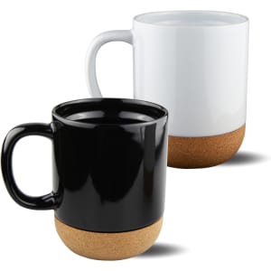 Two mugs with cork bases: one black and one white, both featuring large handles.