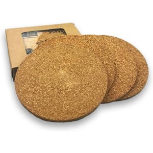 A round set of four natural cork coasters in a brown cardboard box, featuring a simple design.