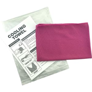 A pink cooling towel in a pouch, accompanied by an instruction sheet, all packaged in a clear plastic bag.