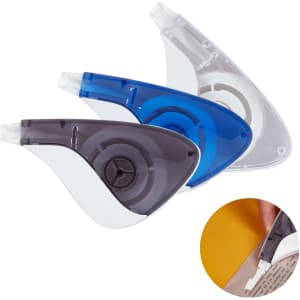 Three correction tape dispensers in grey, transparent, and blue, with a circular design and a logo on one.